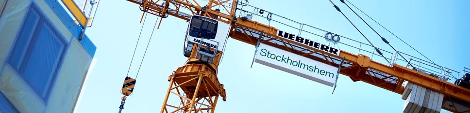 Byggkran med Stockholmshems-logga